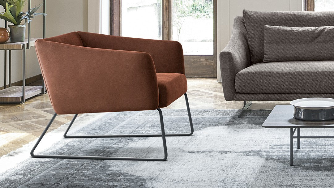 ARMCHAIRS AND POUFS